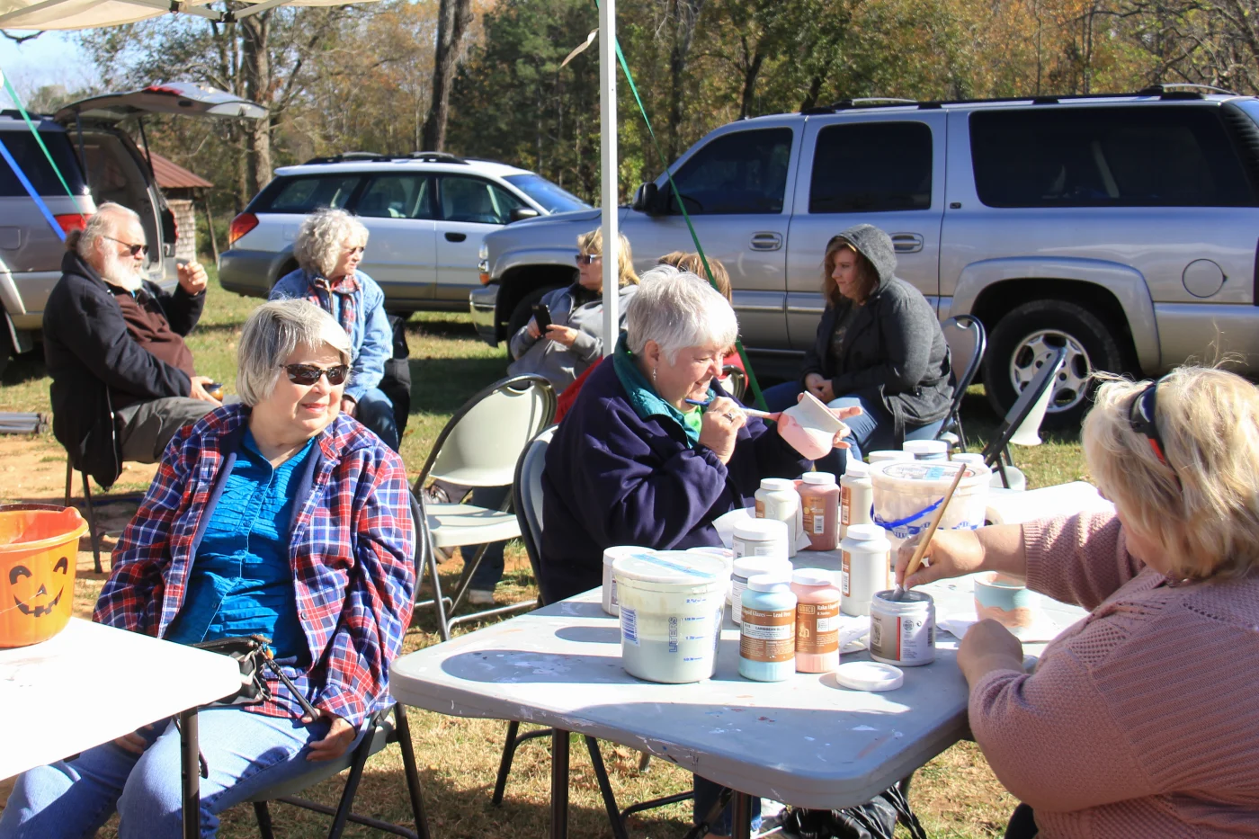 Students glazing raku pottery at a PACA workshop